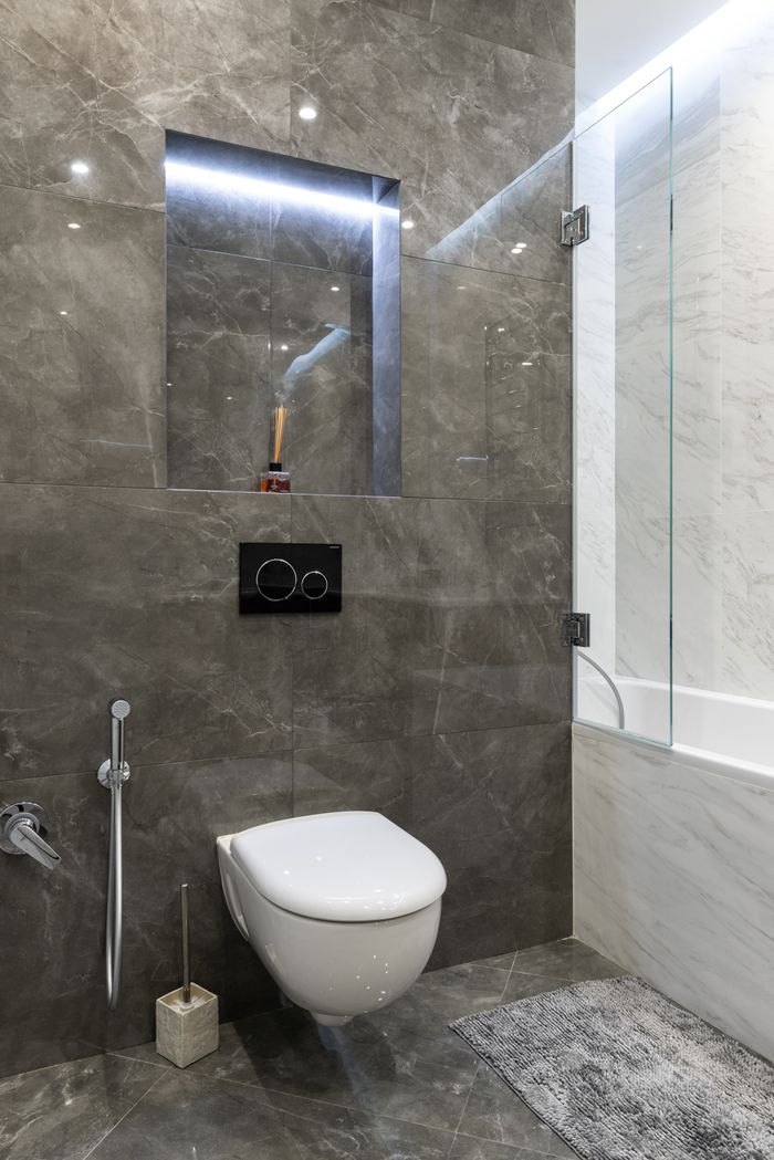 Crafting Captivating Headlines: Your awesome post title goes here Elegant modern bathroom with marble walls and fixtures.